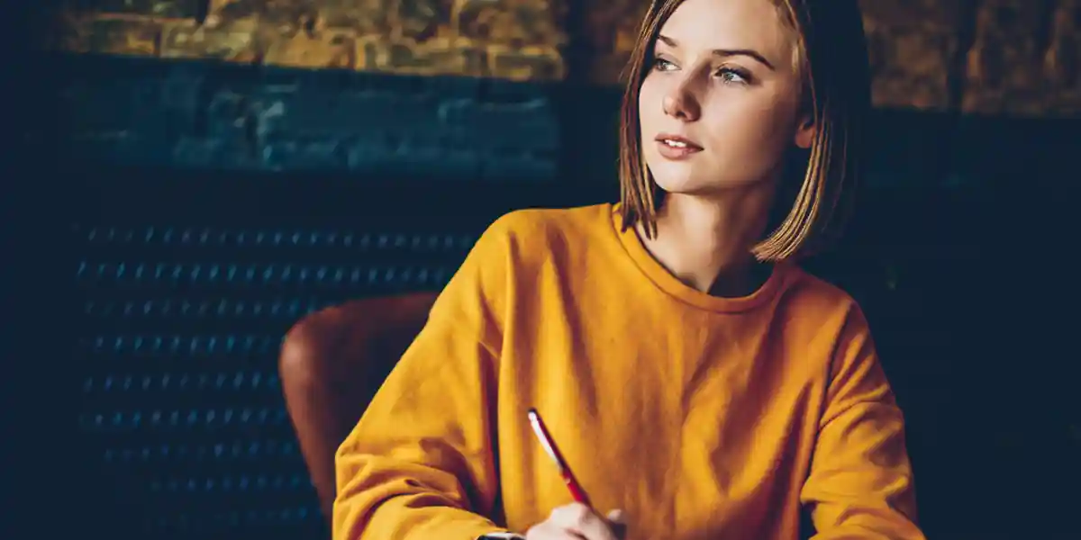 woman leader, staring out into the distance, focusing on more mindful personal leadership