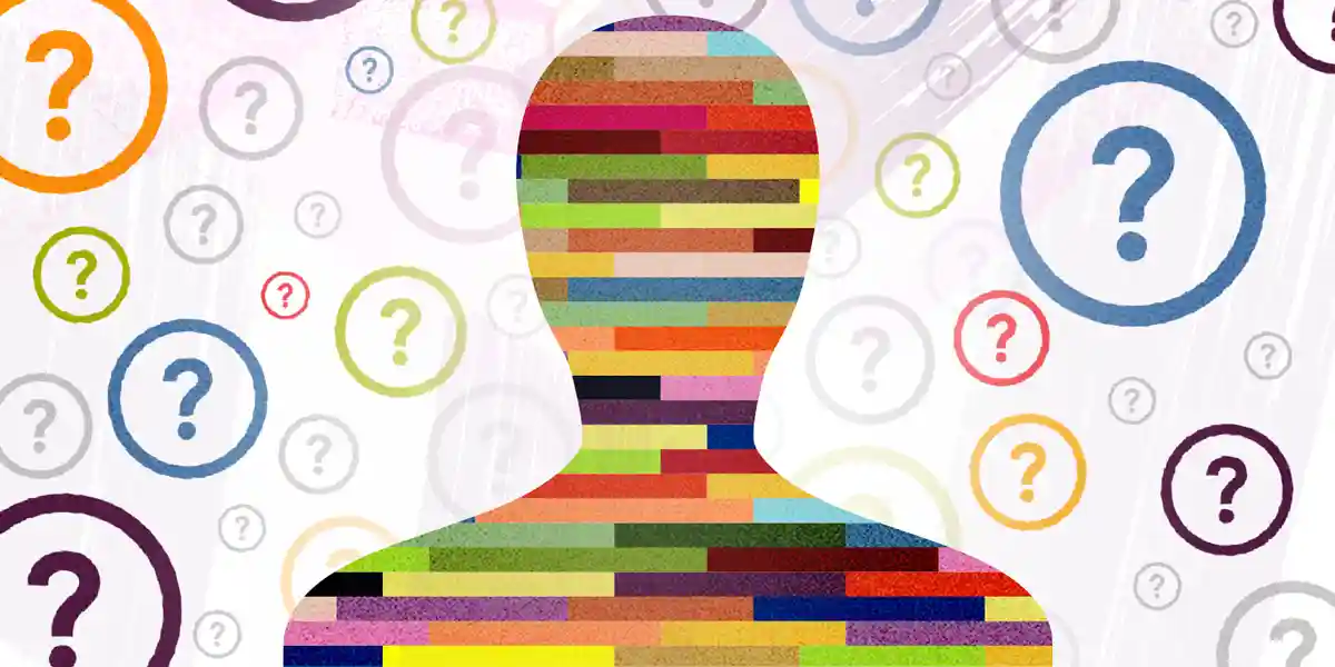 question marks surround a shaded head and upper body of a person filled in with bands of different colors to showcase this blog is about how to use personality tests in the workplace