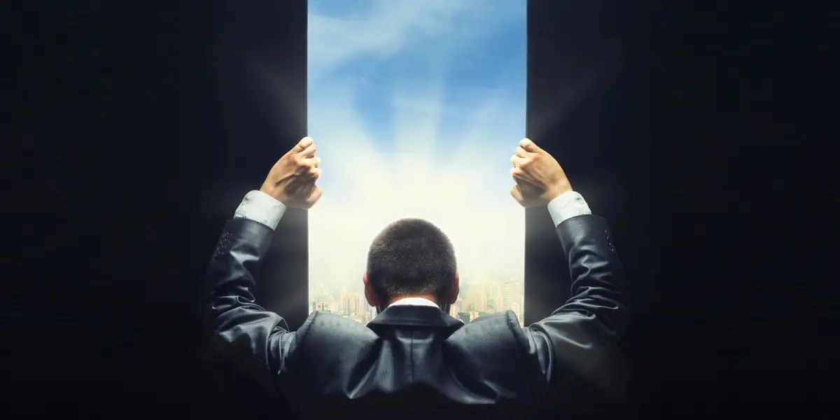 Man opening door to see future of leadership development