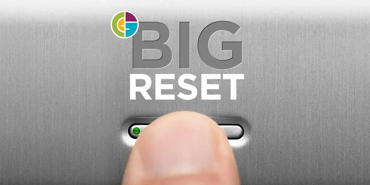 finger pressing the reset button