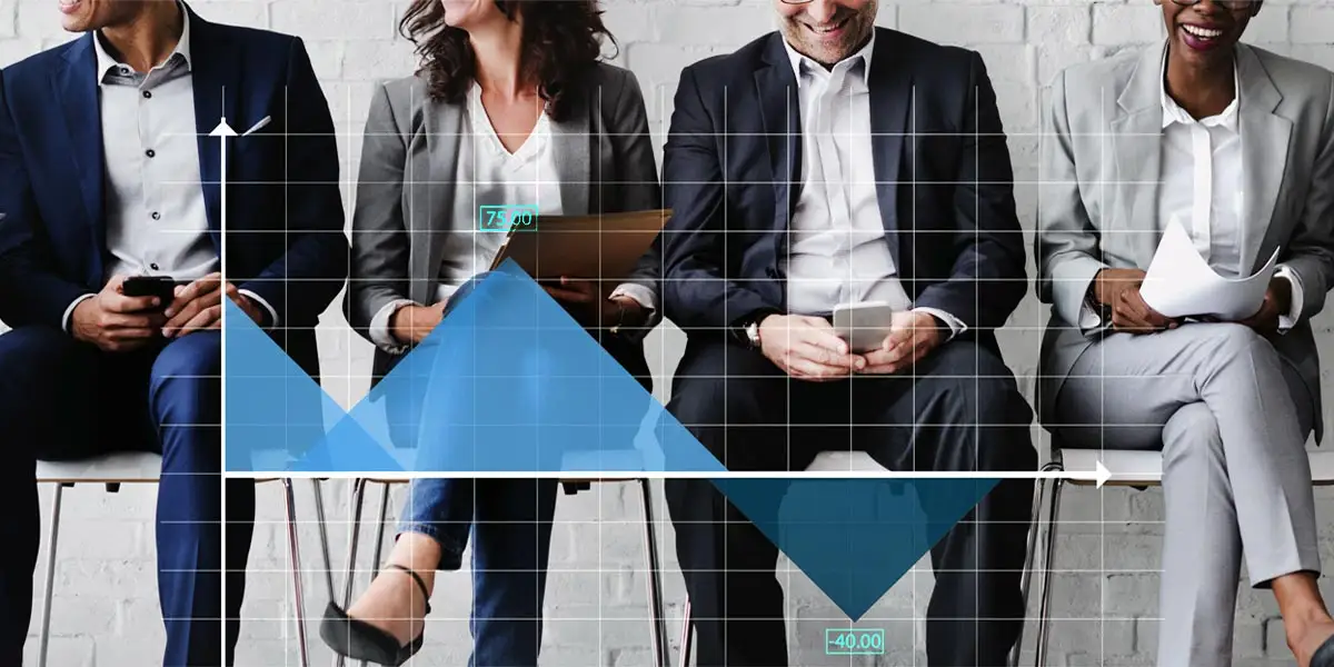 Four leaders sitting in chairs in a row wearing suits. In front of them is a grid with data to represent the results of the leadership simulations they experienced.