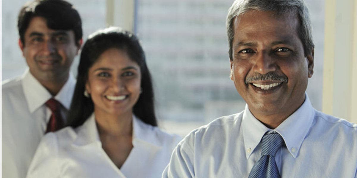 male and female colleagues smiling 