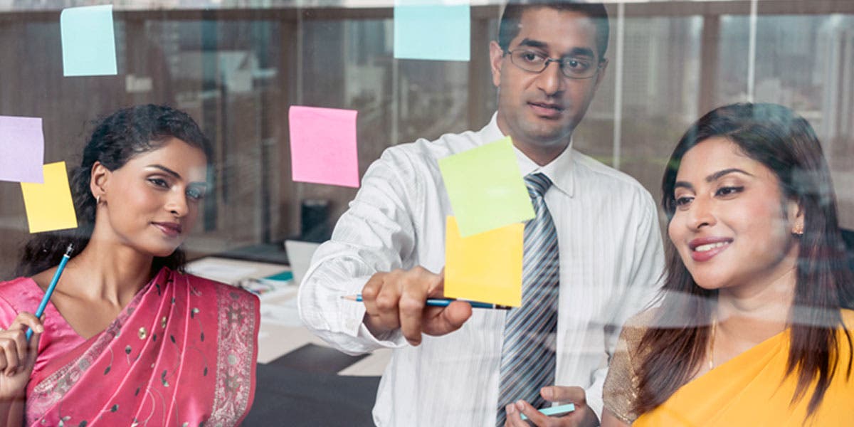 people looking at post-its