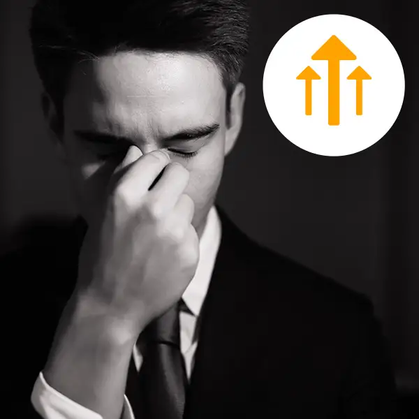 Man holding nose in frustration?fm=webp&q=65