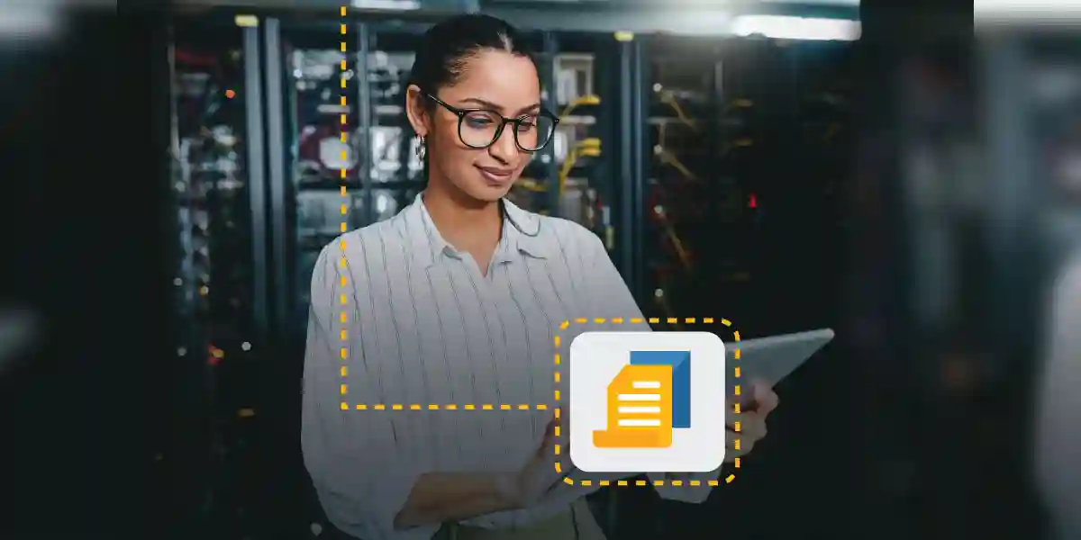 woman smiling about high-potential programs while working on a tablet in a server room