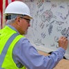 Man signing the beam