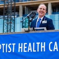 Mark Faulkner President and CEO, Baptist Health Care speaking at topping off beam celebration.
