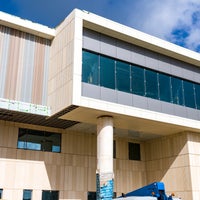view of new section of building with windows and overhang.