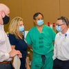 Baptist Health Care team members with masks discussing mock up day.