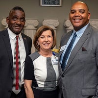 Team members pose for picture during new Baptist Hospital announcement.