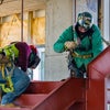 Two workers on a staircase