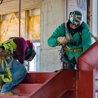 Two workers on a staircase
