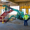 A group of men using machinery