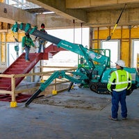 A group of men using machinery 
