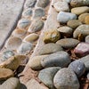 Stones being installed in park feature