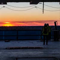 A sunset with workers present