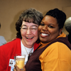 Working at a great place and creating lasting friendships two women smiling at camera