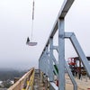 Crane bringing the beam into place