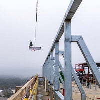 Crane bringing the beam into place