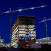 Image of the building at night with lights on