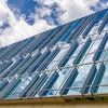 New campus exterior of glass panes on building.