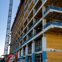 A side profile of building with crane