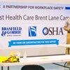 Man in front of sign thanking subcontractors