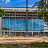 Front of new Baptist Hospital with partially windows installed.