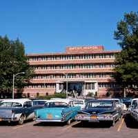 Baptist Hospital front entrance with snazzy cars.