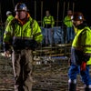 Workers looking off in the distance
