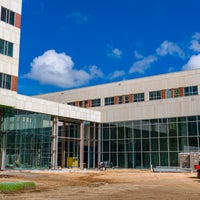 New campus exterior of glass wall.