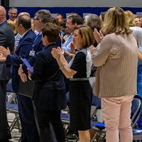 Crowd reacting to Mark Faulkner President and CEO of Baptist Health Care announcement of new Baptist Hospital plan