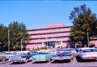 Baptist Hospital front entrance with snazzy cars.