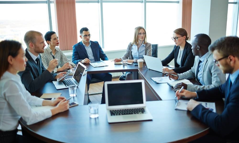 Meeting of shareholders around a table.jpg