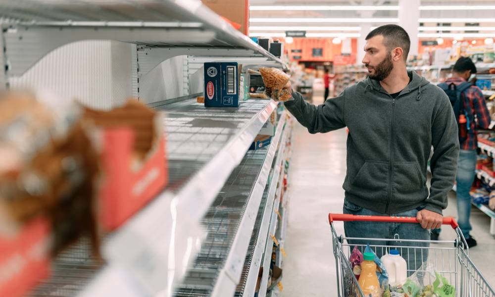 Man shopping at Woolworths during COVID-19 pandemic.jpeg