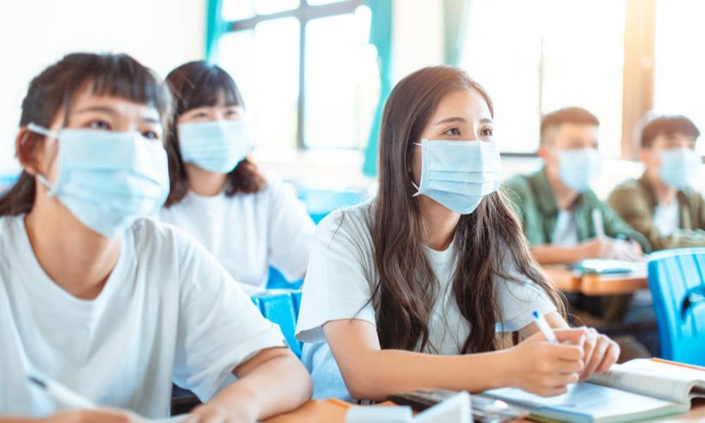 Students wear protective face masks indoors China.jpeg