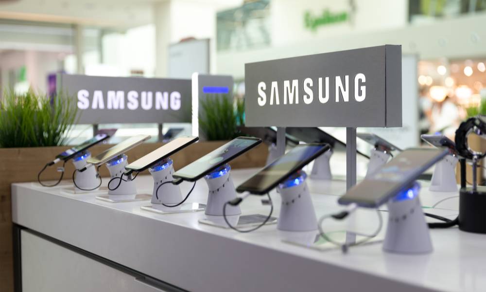 Samsung Galaxy Smartphones are shown on display in electronic store with brand logo in the background.jpg