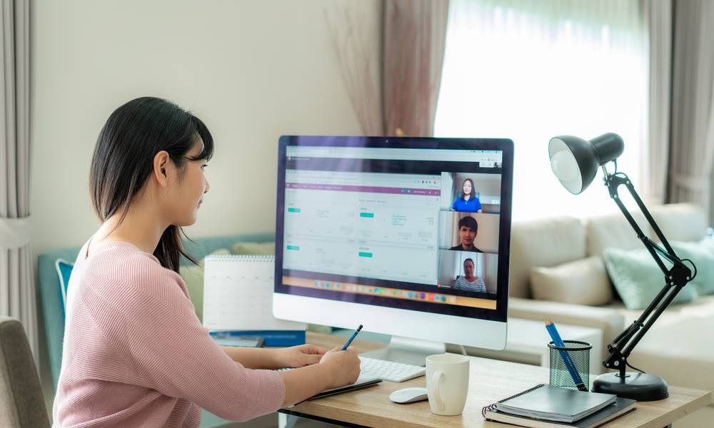 Employee working from home on a video call using a computer (1).jpg