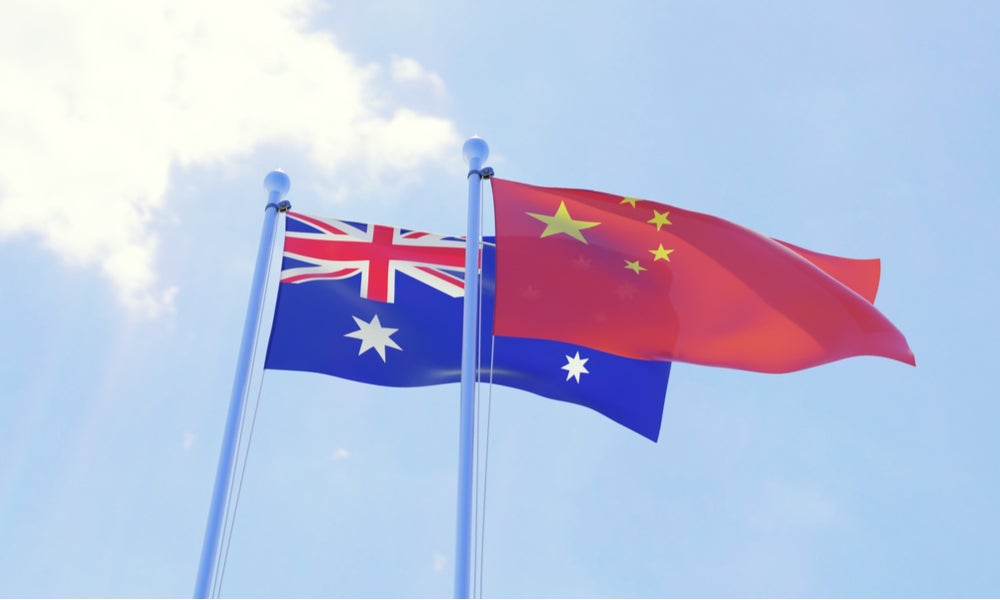 Australian and Chinese flag blowing in the wind-min.jpg