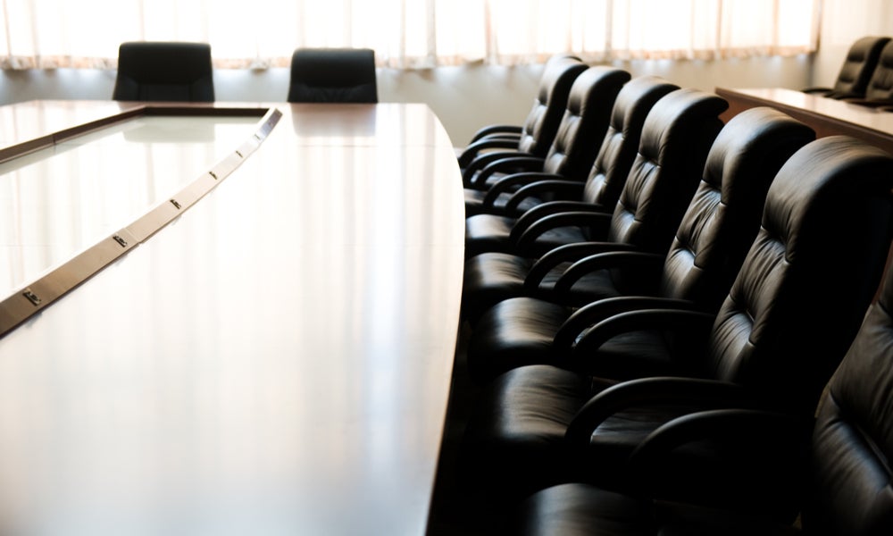 Empty boardroom table and chairs-min.jpg