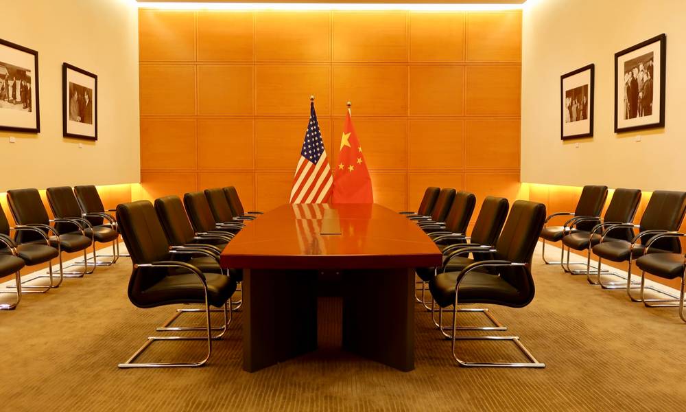 A conference room with Chinese and American flags (1).jpg