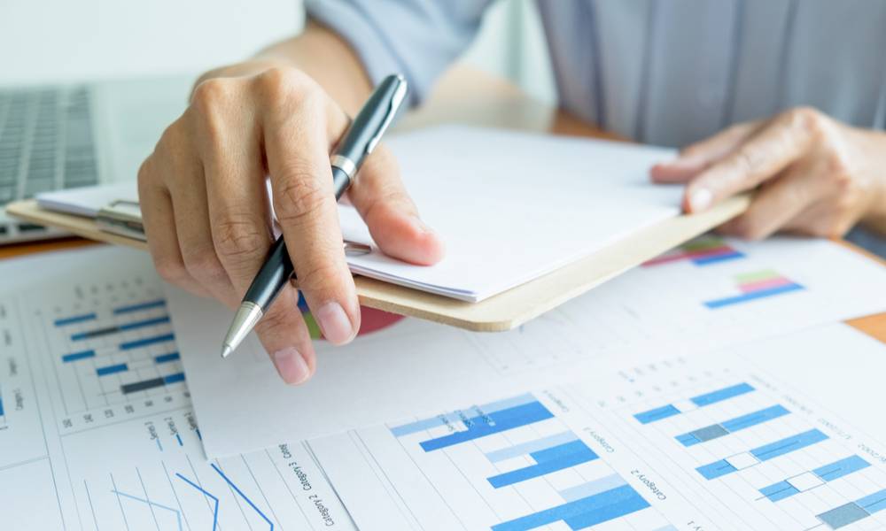 Student analysing investment charts studying for business success MBA.jpeg