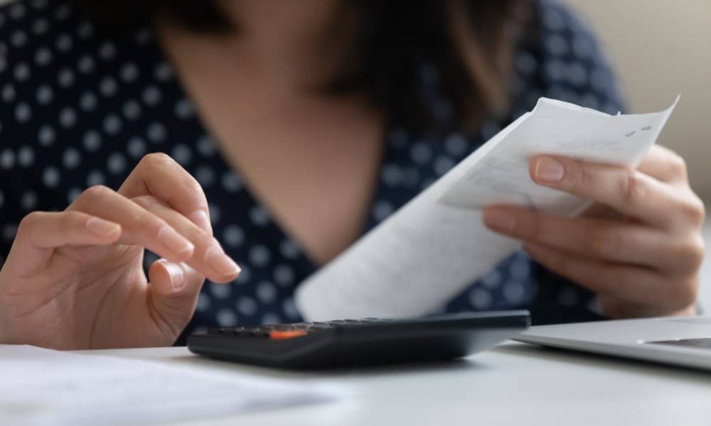 Woman calculating receipt.jpg