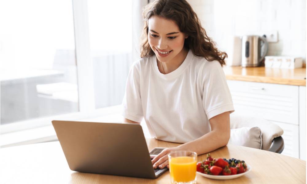 Woman working snacking on healthy fruit.jpeg