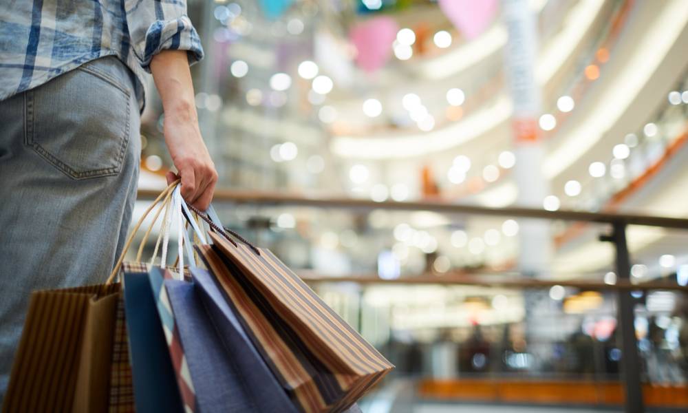 Man with bags full of shopping.jpg