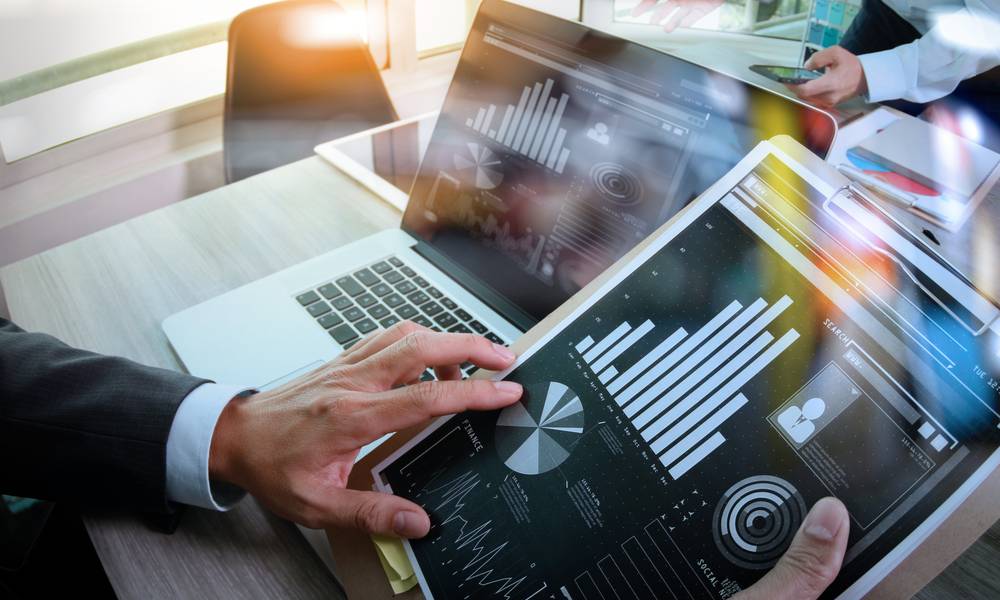 Businessman making presentation with his colleagues and business tablet digital computer at the office as concept.jpeg