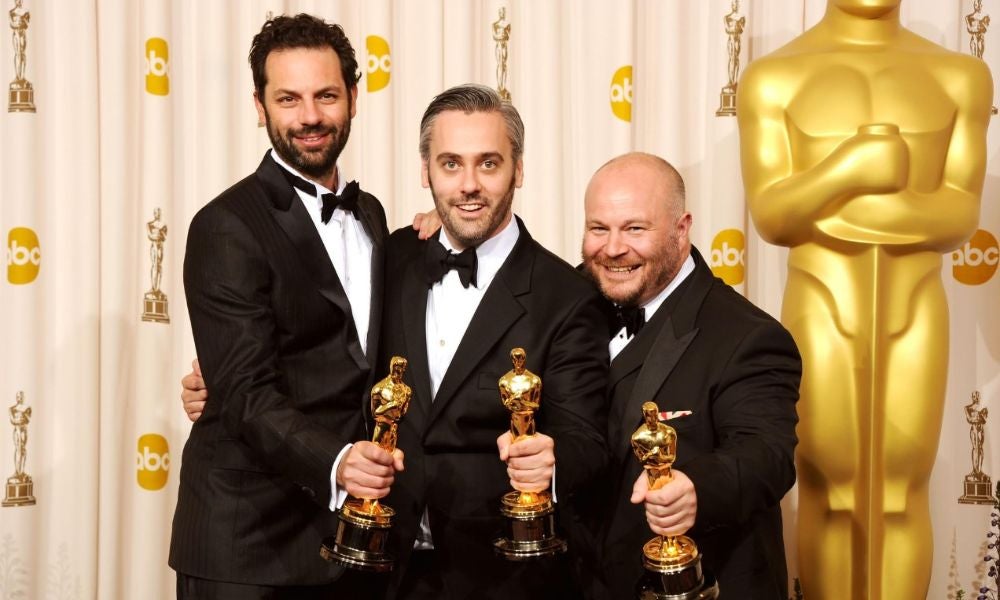 Emile Sherman (left) and producers Iain Canning and Gareth Unwin won the the Best Picture Oscar for The King’s Speech in 2011.jpg