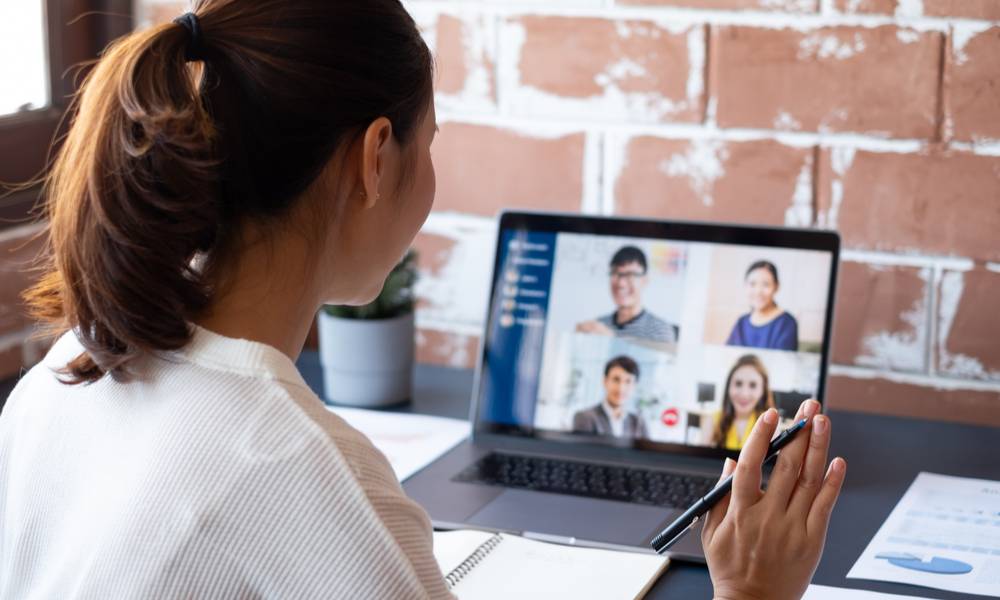 Young Asian businesswoman work at home and virtual video conference meeting with colleagues business people, online working, video call due to social distancing at home office.jpeg
