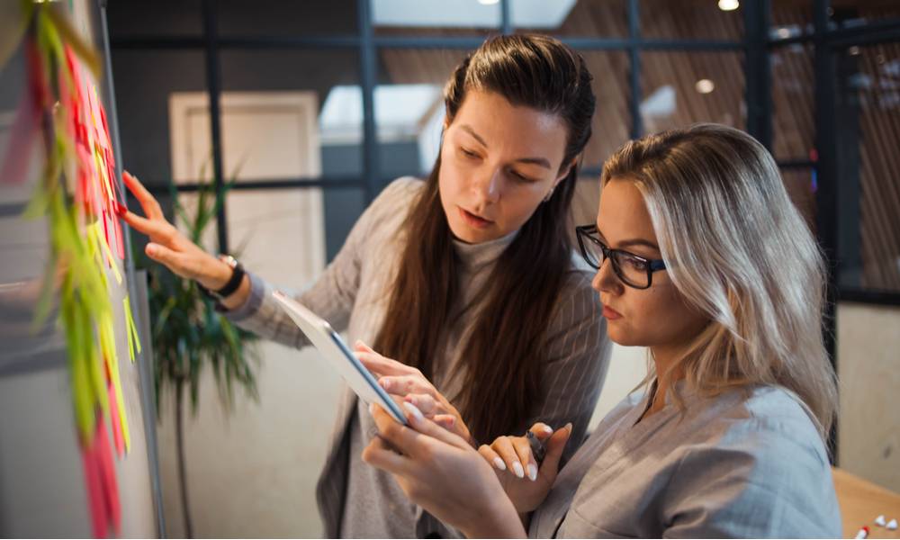 Two young business women working on a project (1).jpg