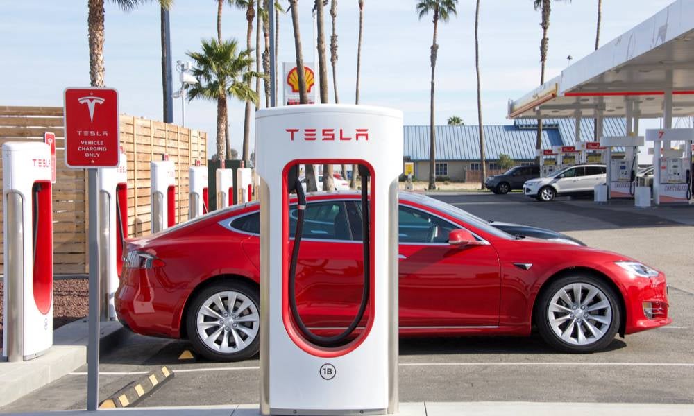 Tesla EV car charging at petrol station.jpeg